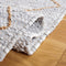 SAFAVIEH Suseela Modern Handmade Area Rug